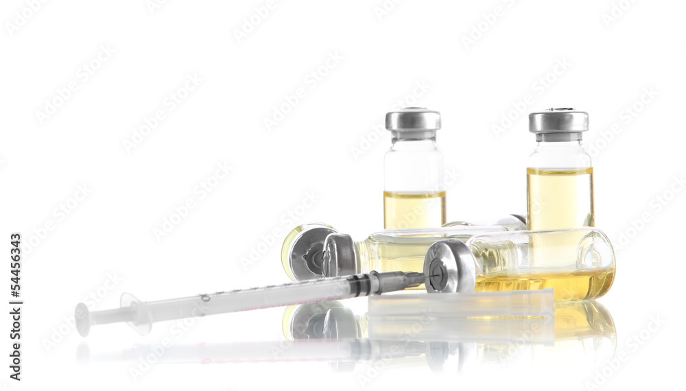 Medical bottle and syringe isolated on white