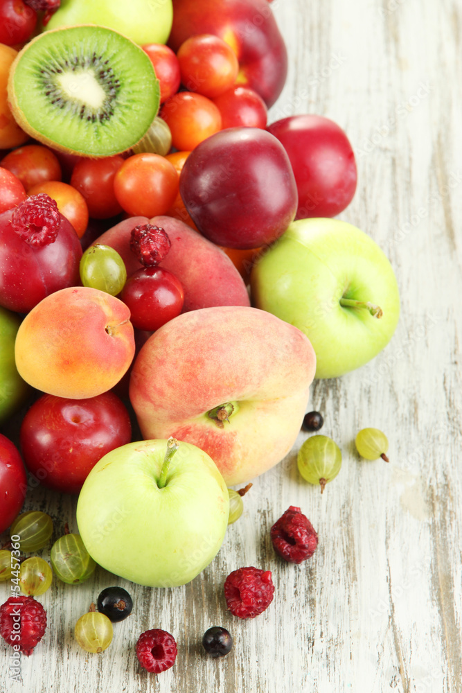 Assortment of juicy fruits, on wooden background Assortment of juicy fruits, on wooden background