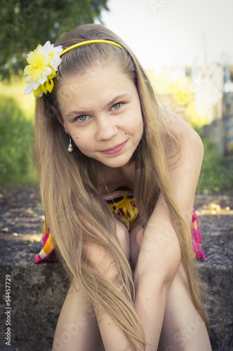 young teenage girl posing with a cute smile photo