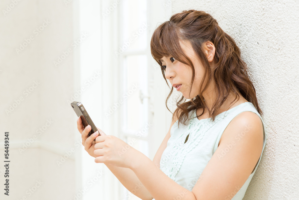 Beautiful young woman using a cellular Beautiful young woman using a cellular