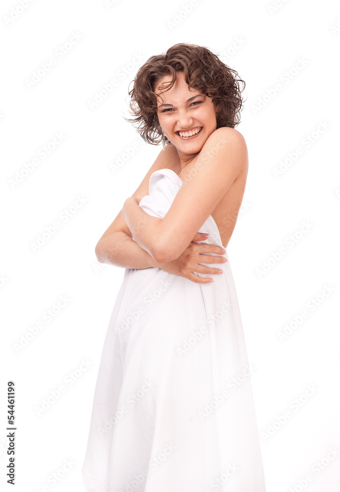 A smiling girl, clothed a white sheet on a white background A smiling girl, clothed a white sheet on a white background