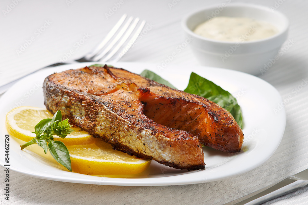 Grilled Salmon Steak with Lemon and Basil on Plate
