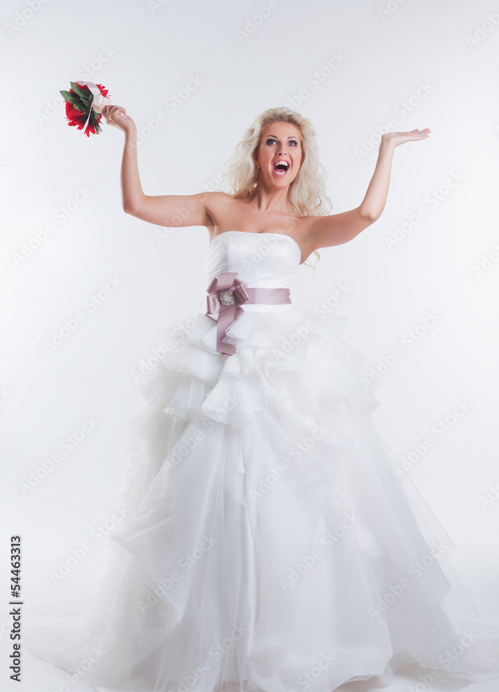 Cheerful model posing in elegant wedding dress Cheerful model posing in elegant wedding dress