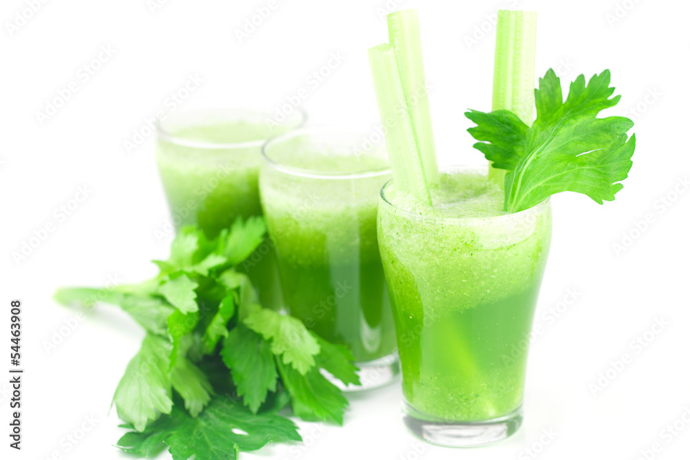 celery and three glasses with celery juice isolated on white