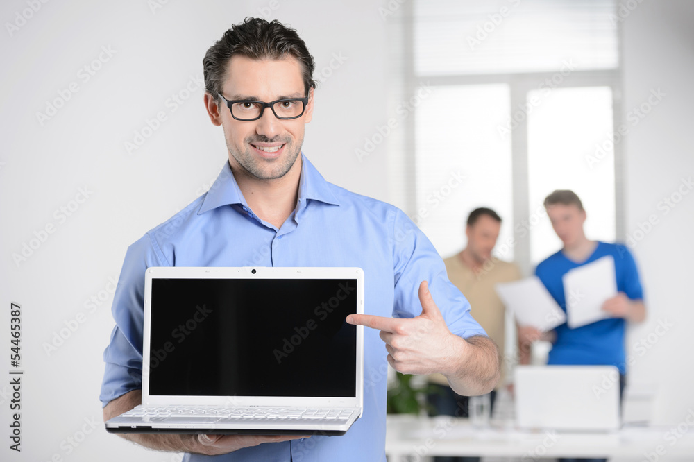 Men with laptop. Happy young businessman holding a laptop and po Men with laptop. Happy young businessman holding a laptop and po