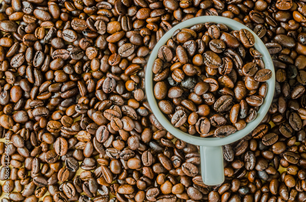 Coffee beans on cup Coffee beans on cup
