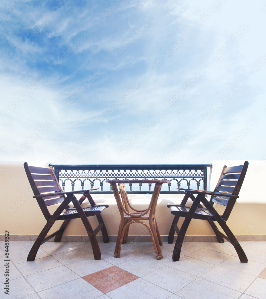 Two chairs on the balcony on the Santorini island, Greece Two chairs on the balcony on the Santorini island, Greece