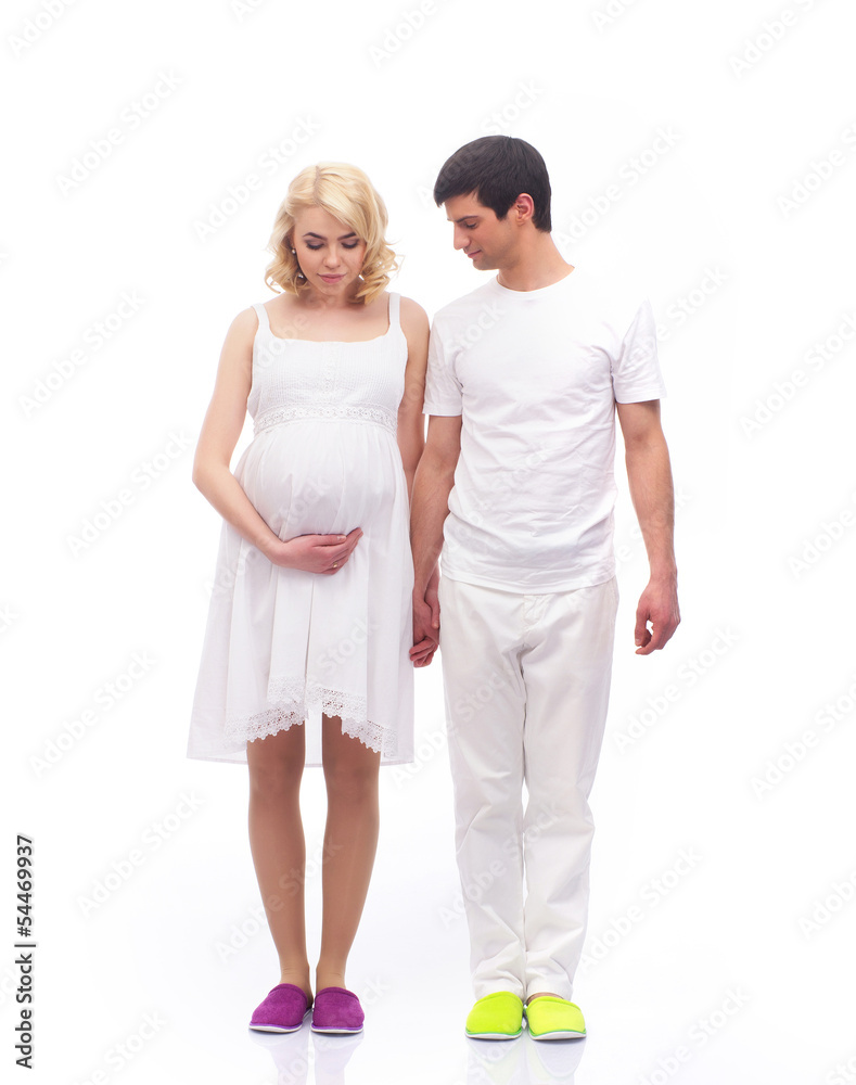 A young couple in white clothes waiting for the baby
