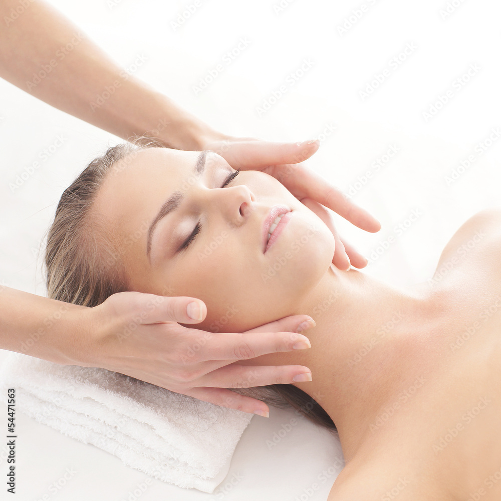 Portrait of a woman relaxing on a head massage procedure
