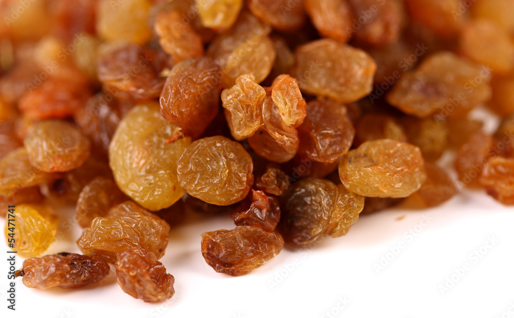Golden raisins are located on top background Golden raisins are located on top background