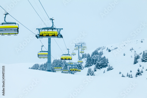 Ski lift with chairs. Lift to the top of the mountain at ski re