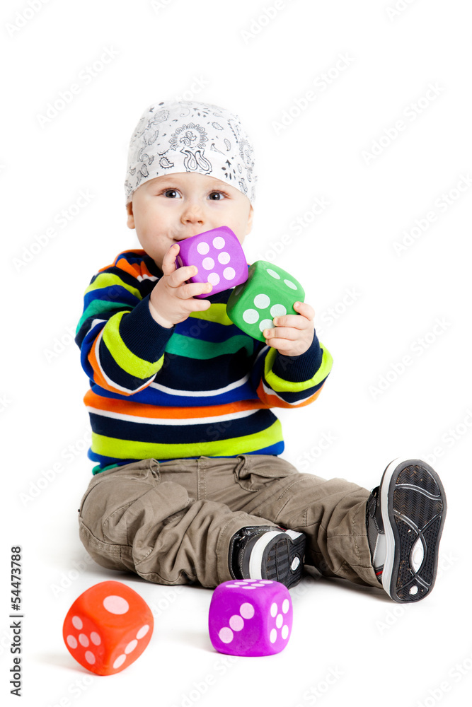 baby is playing with toys over white background. Funny little k baby is playing with toys over white background. Funny little k