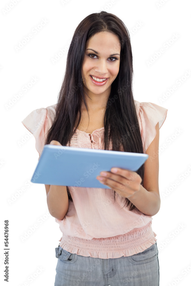 Smiling young woman using tablet pc Smiling young woman using tablet pc