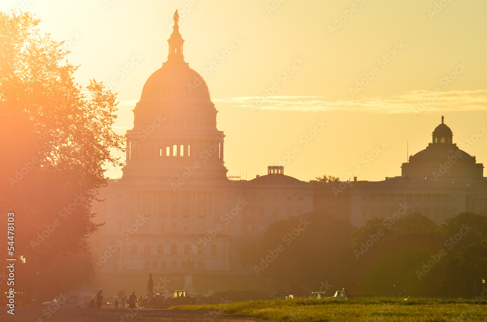 US Capitol Building silhouette during sunrise in autumn - Washington DC, USA