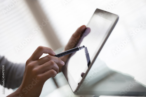 Bilde på lerret Close-up of woman working with stylus and digital tablet pc