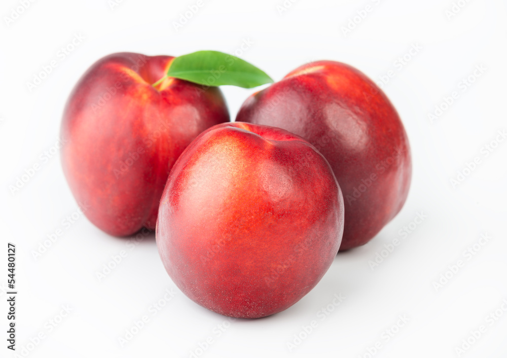 Three ripe peaches