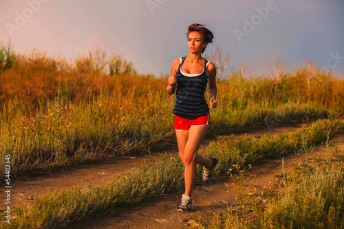 beautiful healthy runs young brunette woman a athlete running ou