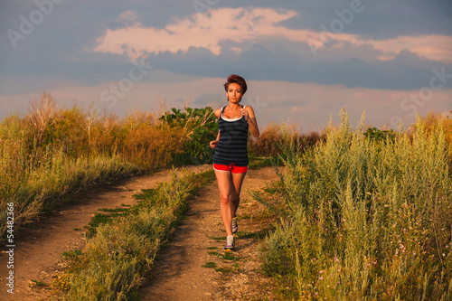 beautiful healthy runs young brunette woman athlete running outd