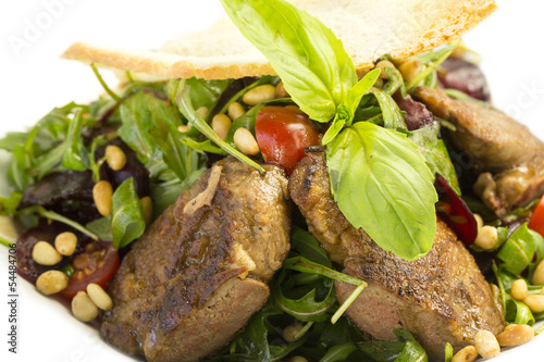 rabbit liver salad with arugula in a restaurant