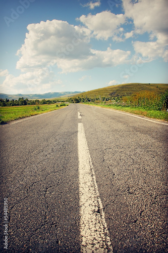 Deserted road towards the mountains