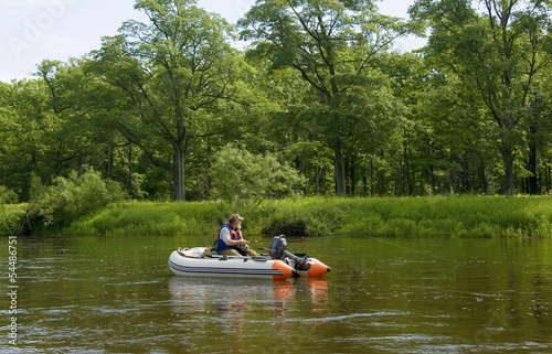 Fisherman in boat fishing