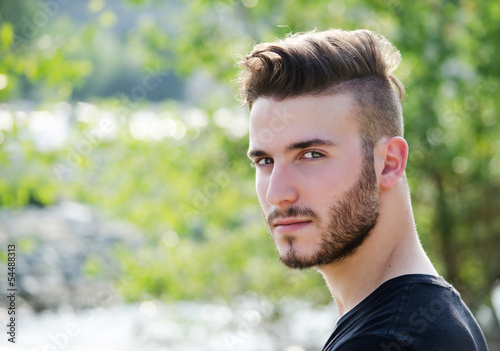 Portrait of attractive young man outdoors