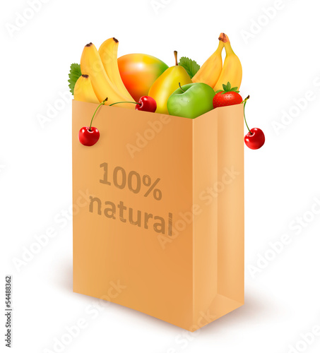 100 percent natural on a paper bag full of fresh fruits. Concept