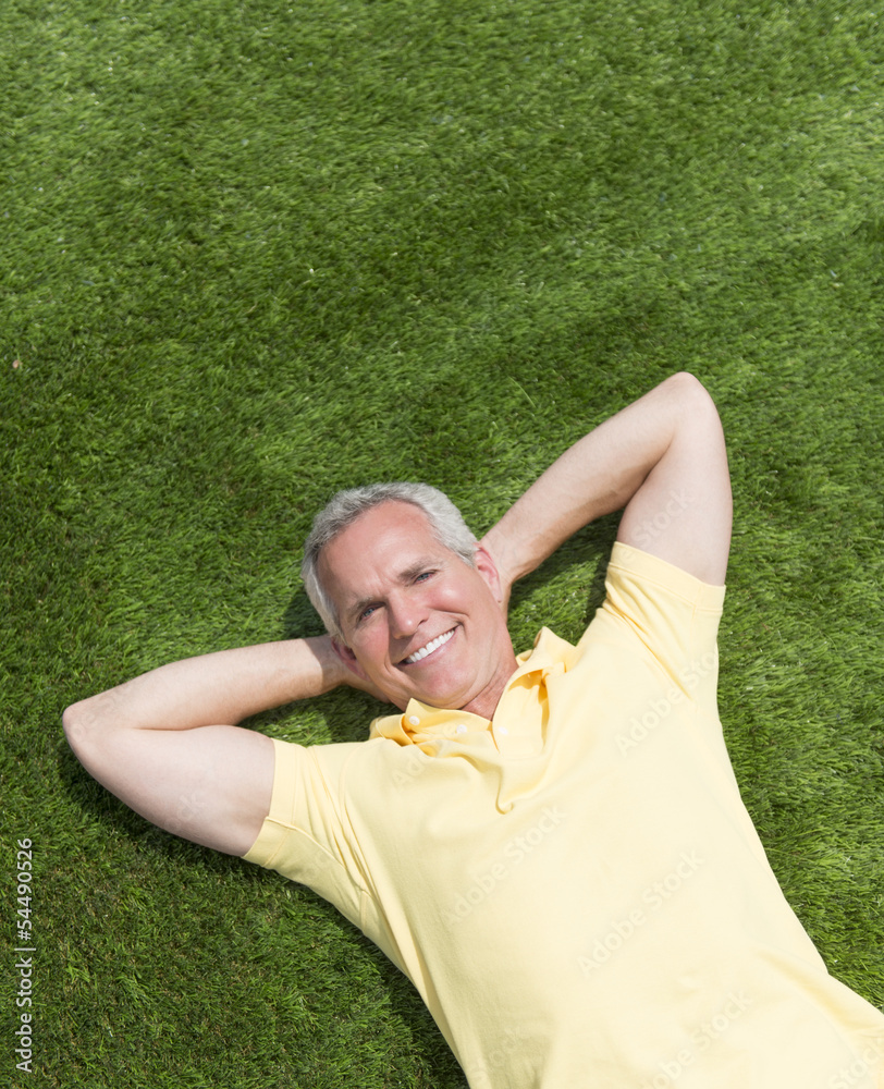 Portrait Of Happy Man Lying On Grass Portrait Of Happy Man Lying On Grass