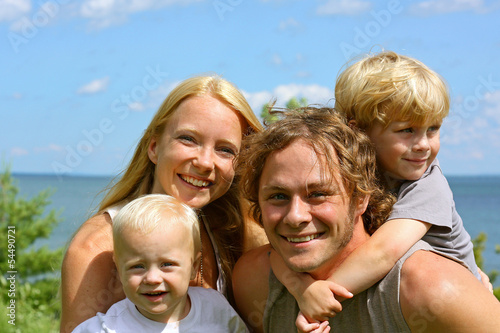 Happy Family Outside by Lake