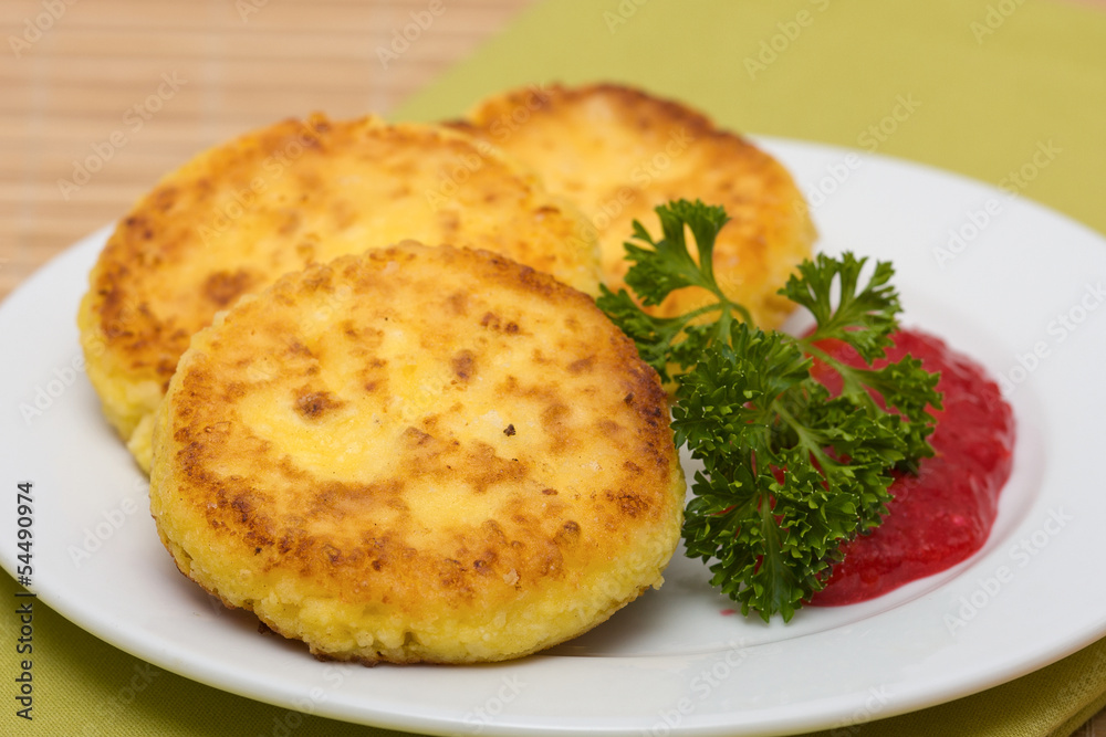 Sweet cheese pancakes on a plate Sweet cheese pancakes on a plate