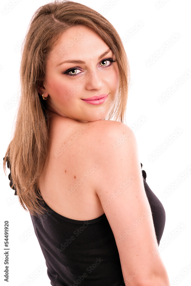 Portrait of a beautiful young woman looking back over her should Portrait of a beautiful young woman looking back over her should