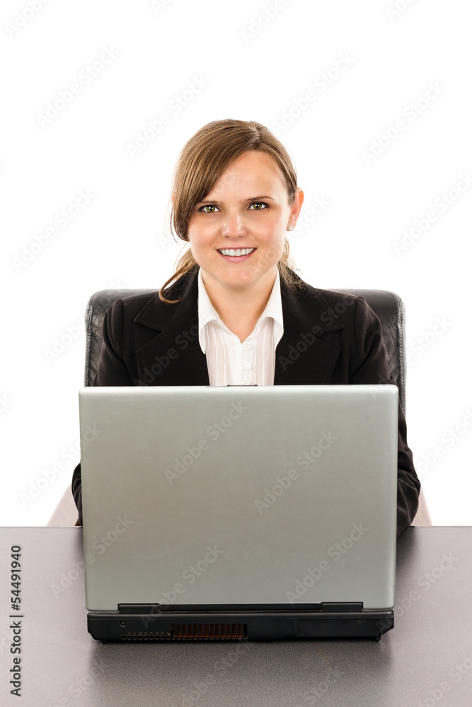 Smiling young businesswoman working at her computer Smiling young businesswoman working at her computer