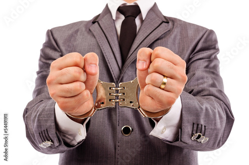 Businessman's hands with handcuffs