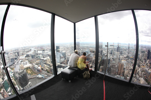 Tourists looking at Melbourne Skyline at Eureka tower