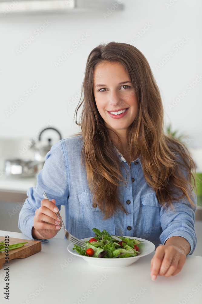 Woman eating a salad