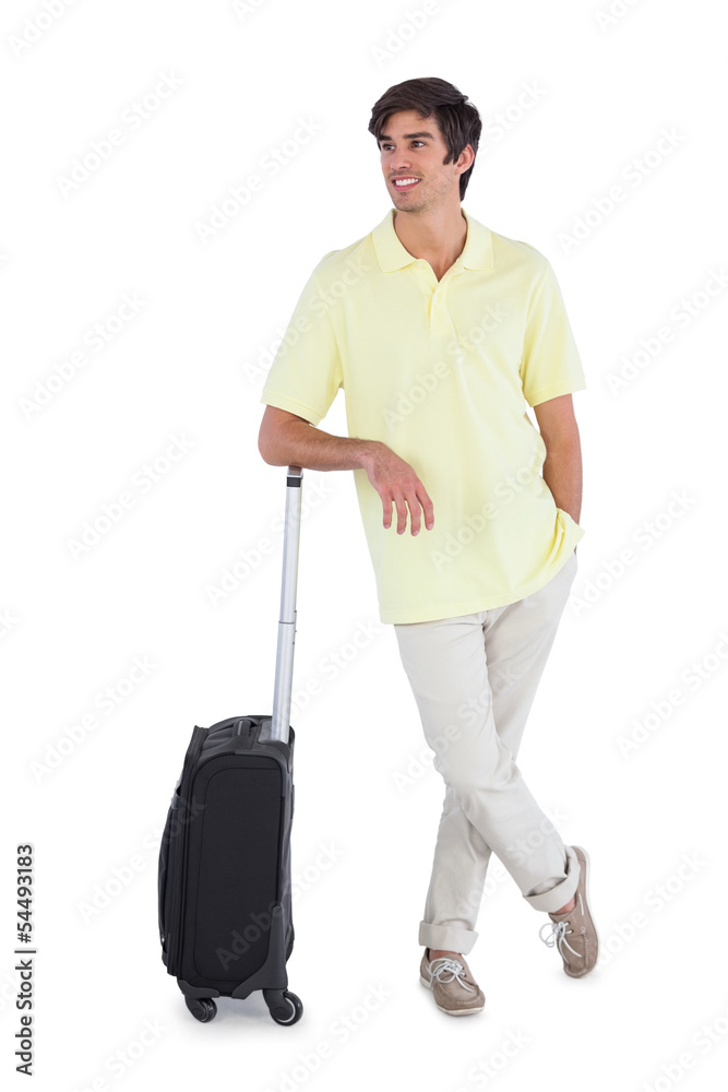 Happy man standing with his suitcase Happy man standing with his suitcase