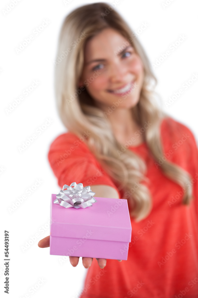 Young woman giving a gift