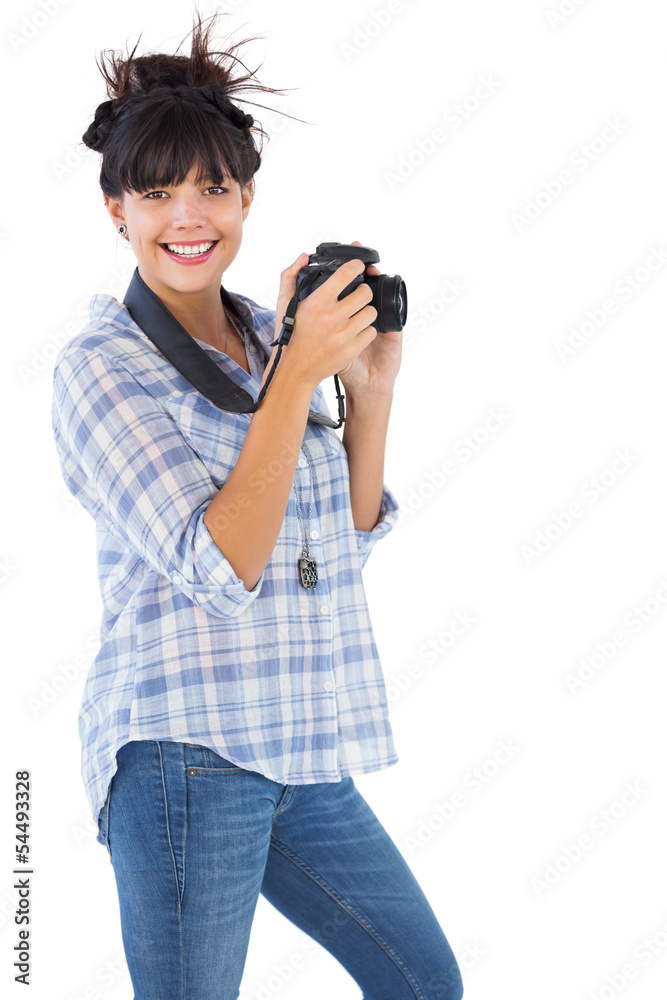 Happy young woman taking picture with her camera Happy young woman taking picture with her camera