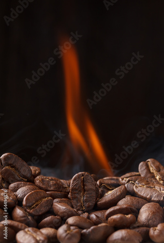 Coffee beans roasting with fire and smoke