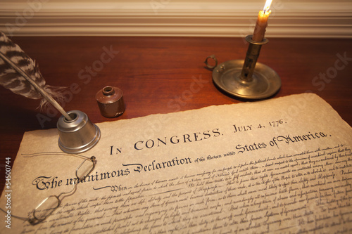 Declaration of Independence with glasses, quill pen and candle