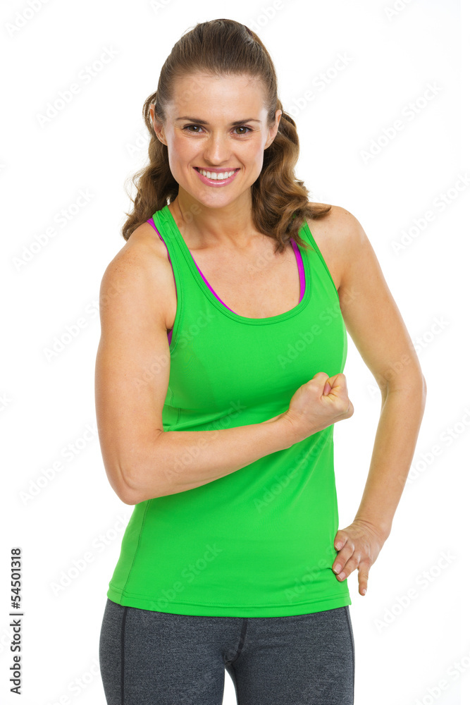 Portrait of smiling female athlete showing biceps Portrait of smiling female athlete showing biceps