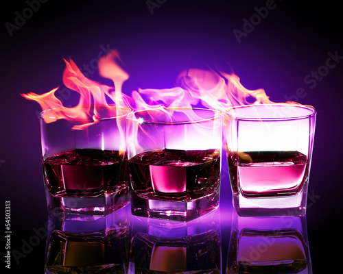 Three glasses of burning purple absinthe #54503313