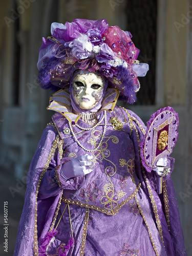 Venetian costume attends Carnival of Venice.