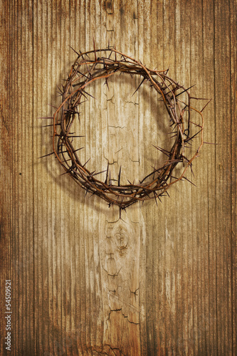 Crown of thorns on grunge wood background