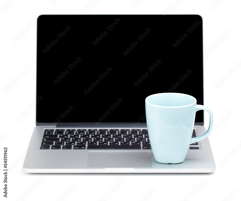 Tea cup on laptop Tea cup on laptop