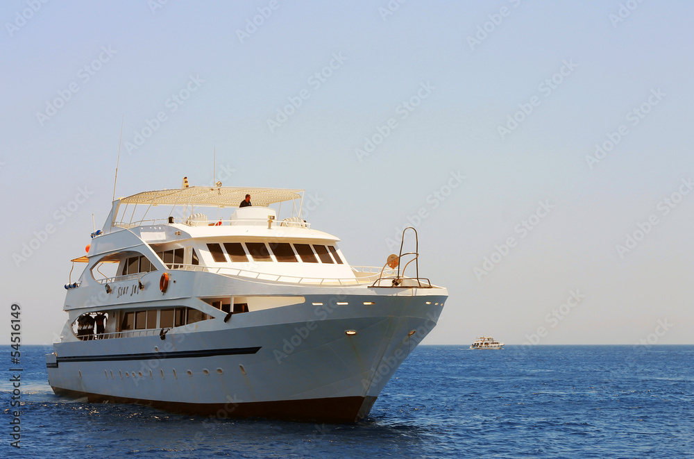 White ship moving by the red sea White ship moving by the red sea