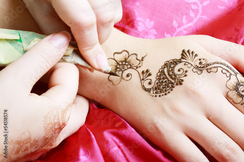 henna being applied to hand © zea_lenanet