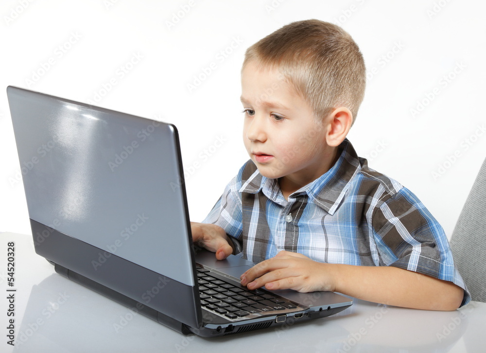 Computer addiction child with laptop notebook Computer addiction child with laptop notebook