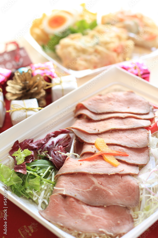 sliced roast beef on food tray with ornaments for Christamas sliced roast beef on food tray with ornaments for Christamas