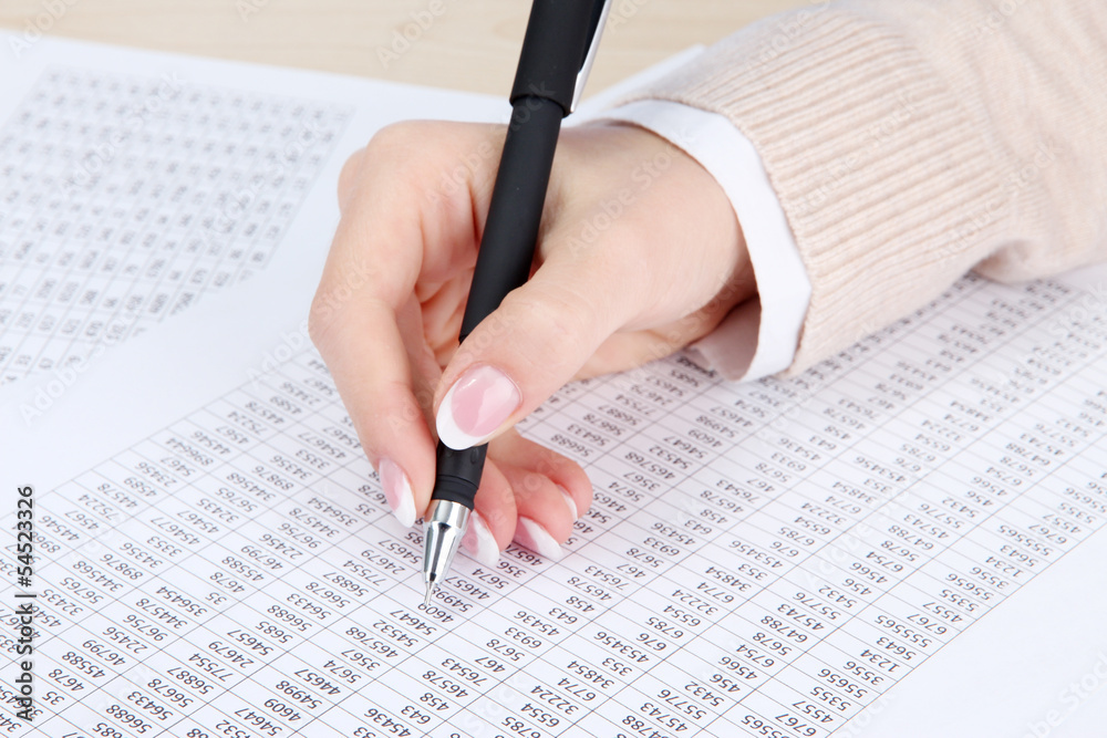 Closeup of businesswoman hand, writing on paper Closeup of businesswoman hand, writing on paper